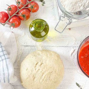 I make homemade pizza dough at least once a week, but that wasn't always the case. I used to think scratch pizza dough would take too long, be too much fuss, and not be worth the effort. How wrong I was! Our five-ingredient pizza dough is foolproof in terms of flavor and freshness. You can count on this simple recipe every time!